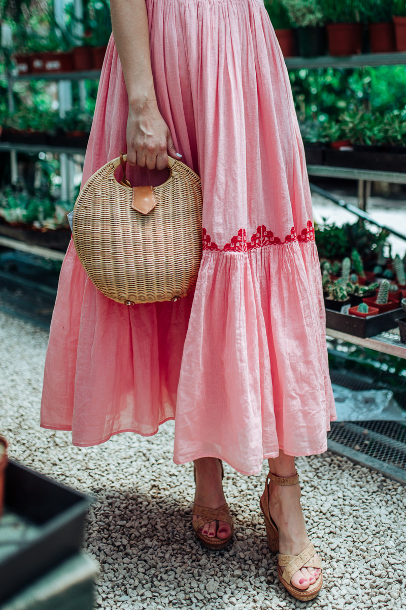 Pink Midi Dress featured by top US fashion blog Lone Star Looking Glass; Image of a woman wearing a pink embroidered midi dress by Carolina K.