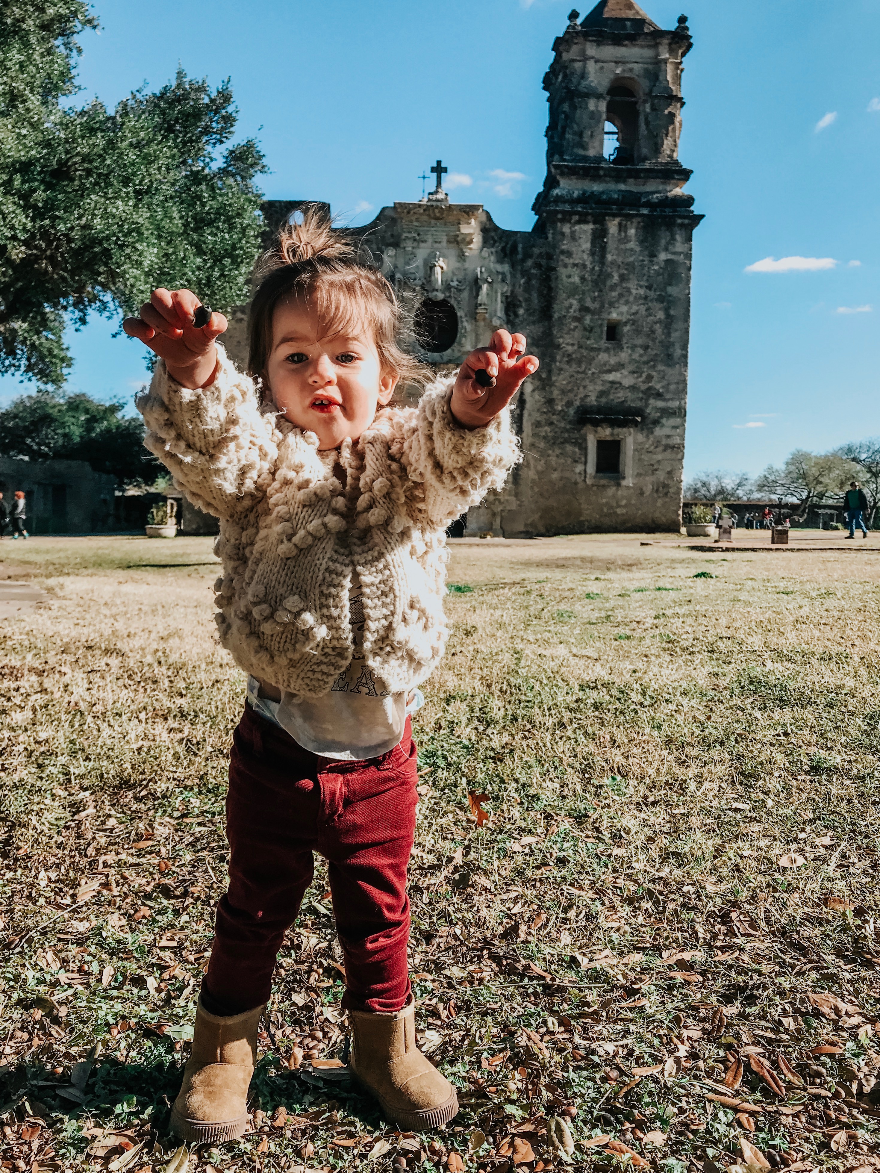 San Antonio in Winter featured by top US travel blog Lone Star Looking Glass; Image of little girl playing
