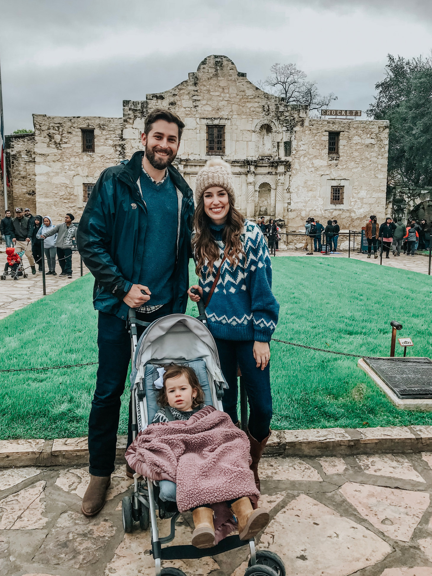 San Antonio in Winter featured by top US travel blog Lone Star Looking Glass; Image of a family walking.