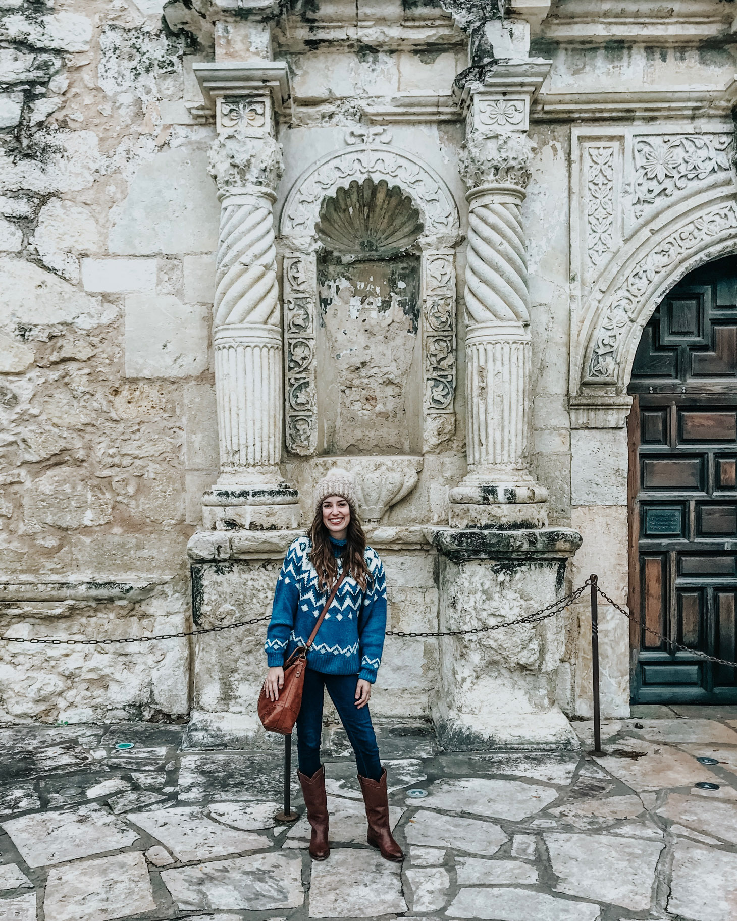 San Antonio in Winter featured by top US travel blog Lone Star Looking Glass; Image of woman wearing blue sweater and boots.