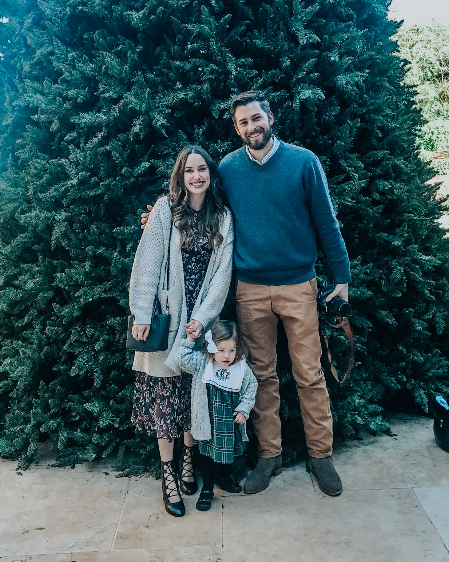San Antonio in Winter featured by top US travel blog Lone Star Looking Glass; Image of family in front of Christmas tree.