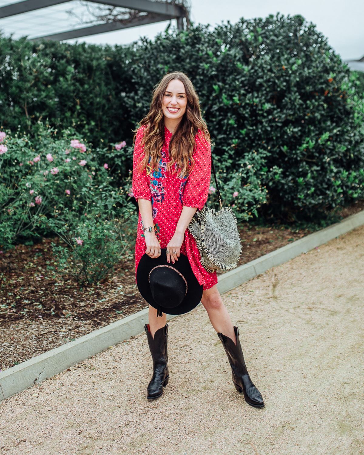Cute Cowboy Boots roundup featured by top Houston fashion blog, Lone Star Looking Glass: image of a woman wearing Lucchese cowboy boots available at Zappos, a SALONI floral dress, Nordstrom Panama hat