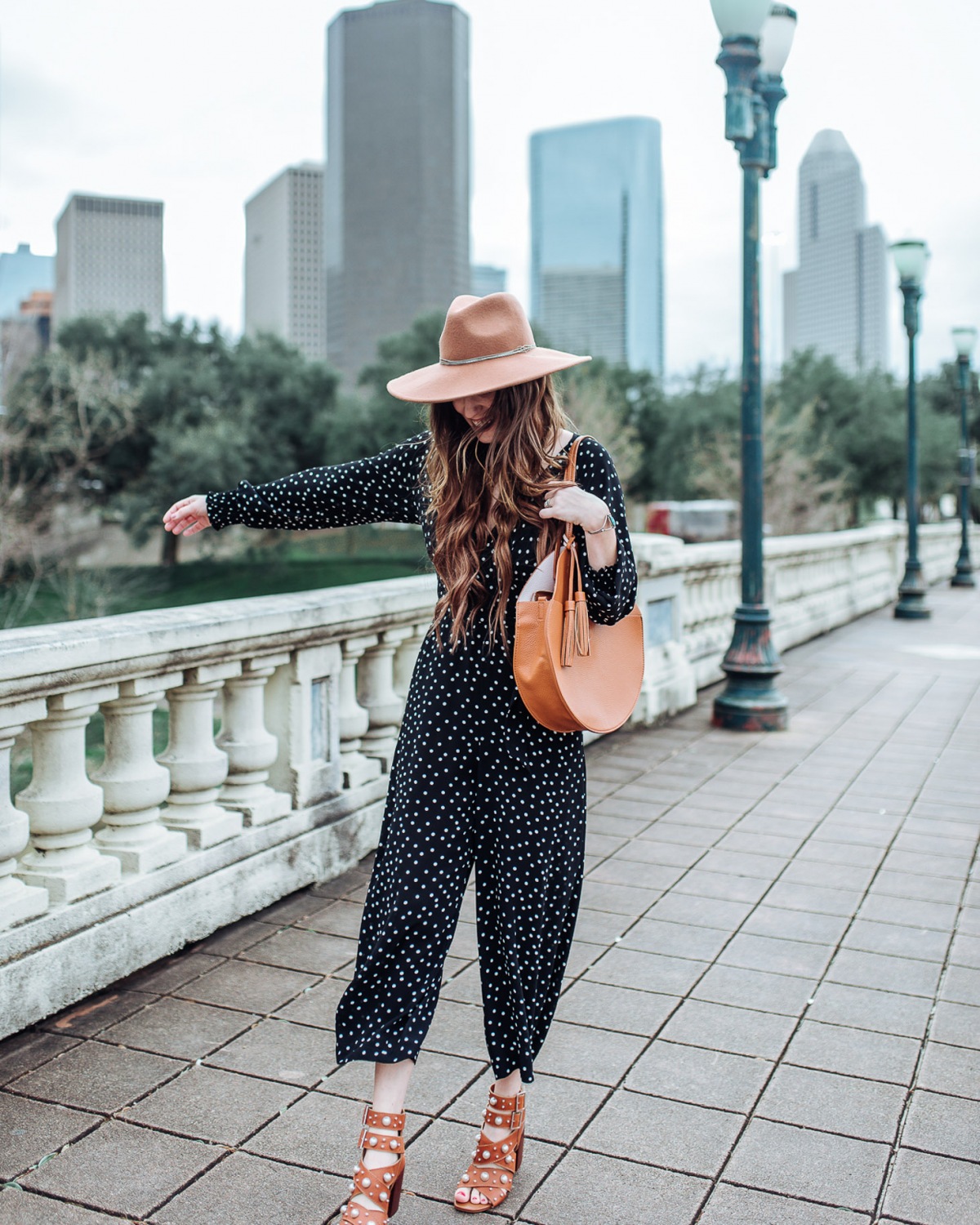 Houston blogger styles black polka dot eliza j jumpsuit for spring.