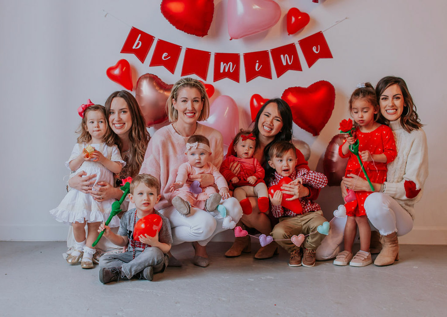 5 Valentine's Day Activities for Toddler to Make Valentine's Day Special featured by top US lifestyle blog, Lone Star Looking Glass: image of moms and toddlers celebrating Valentine's Day together