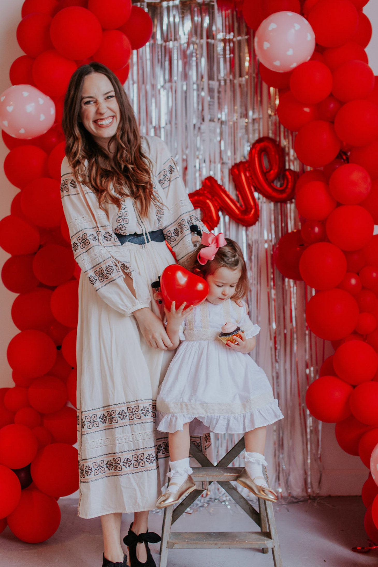 5 Valentine's Day Activities for Toddler to Make Valentine's Day Special featured by top US lifestyle blog, Lone Star Looking Glass: image of a woman wearing a Chicwish embroidered maxi dress, Rebecca Minkoff leather belt and Anthropologie bow shooties