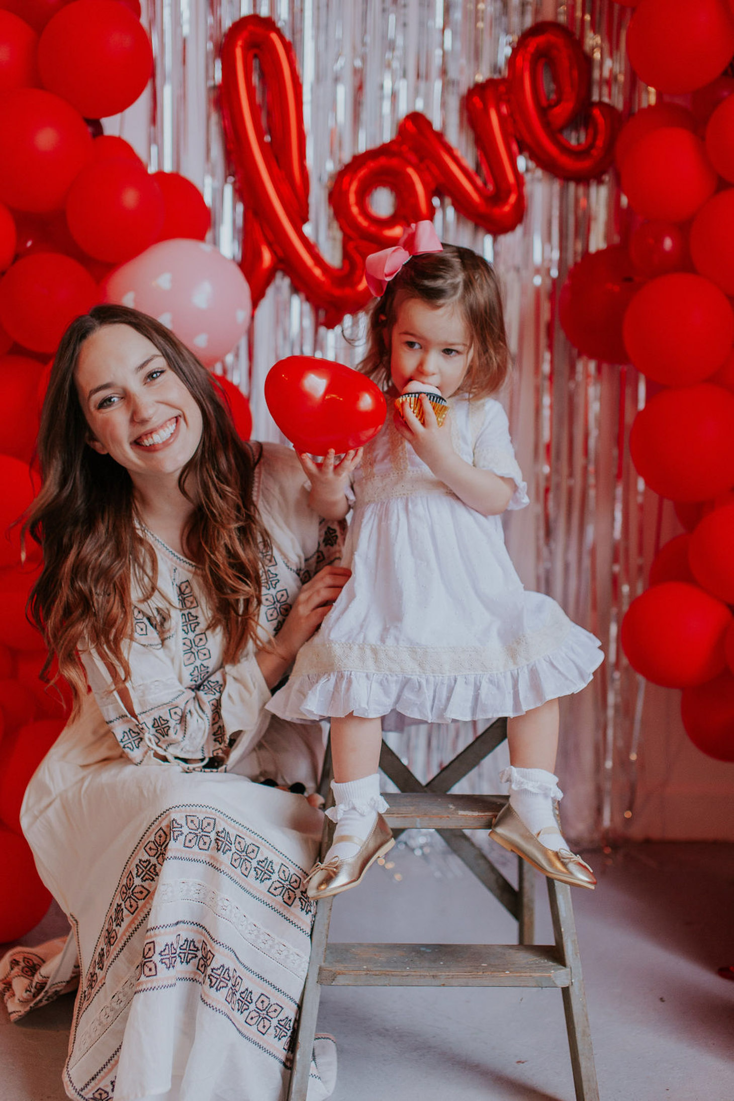 5 Valentine's Day Activities for Toddler to Make Valentine's Day Special featured by top US lifestyle blog, Lone Star Looking Glass: image of a woman wearing a Chicwish embroidered maxi dress, Rebecca Minkoff leather belt and Anthropologie bow shooties