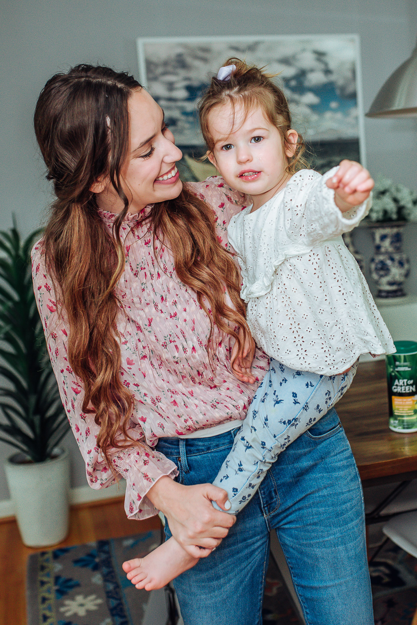 Essential Green Spring Cleaning Tips featured by top US lifestyle blog, Lone Star Looking Glass: image of a woman with her toddler