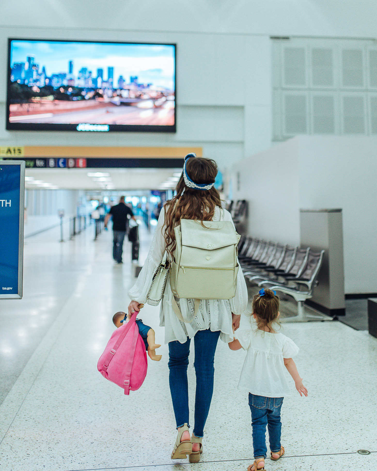 7 tips for flying with a toddler featured by top US travel blog, Lone Star Looking Glass