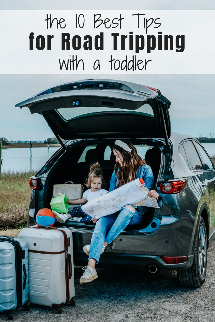 10 Essential Tips for your Next Road Trip with a Toddler featured by top US travel blog, Lone Star Looking Glass: image of a mom and toddler reading a road map