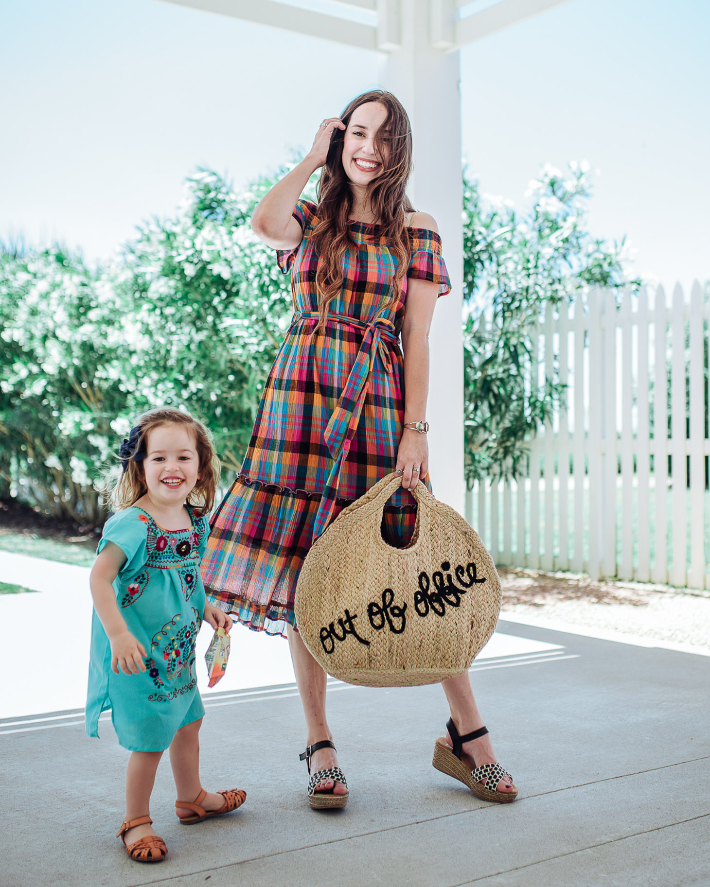 Francesca’s Sundress Outfits to wear for Mothers Day, featured by top US fashion blog, Lone Star Looking Glass: image of a woman wearing a Francesca’s plaid over the shoulder dress, wedge heels and a shopper jute tote