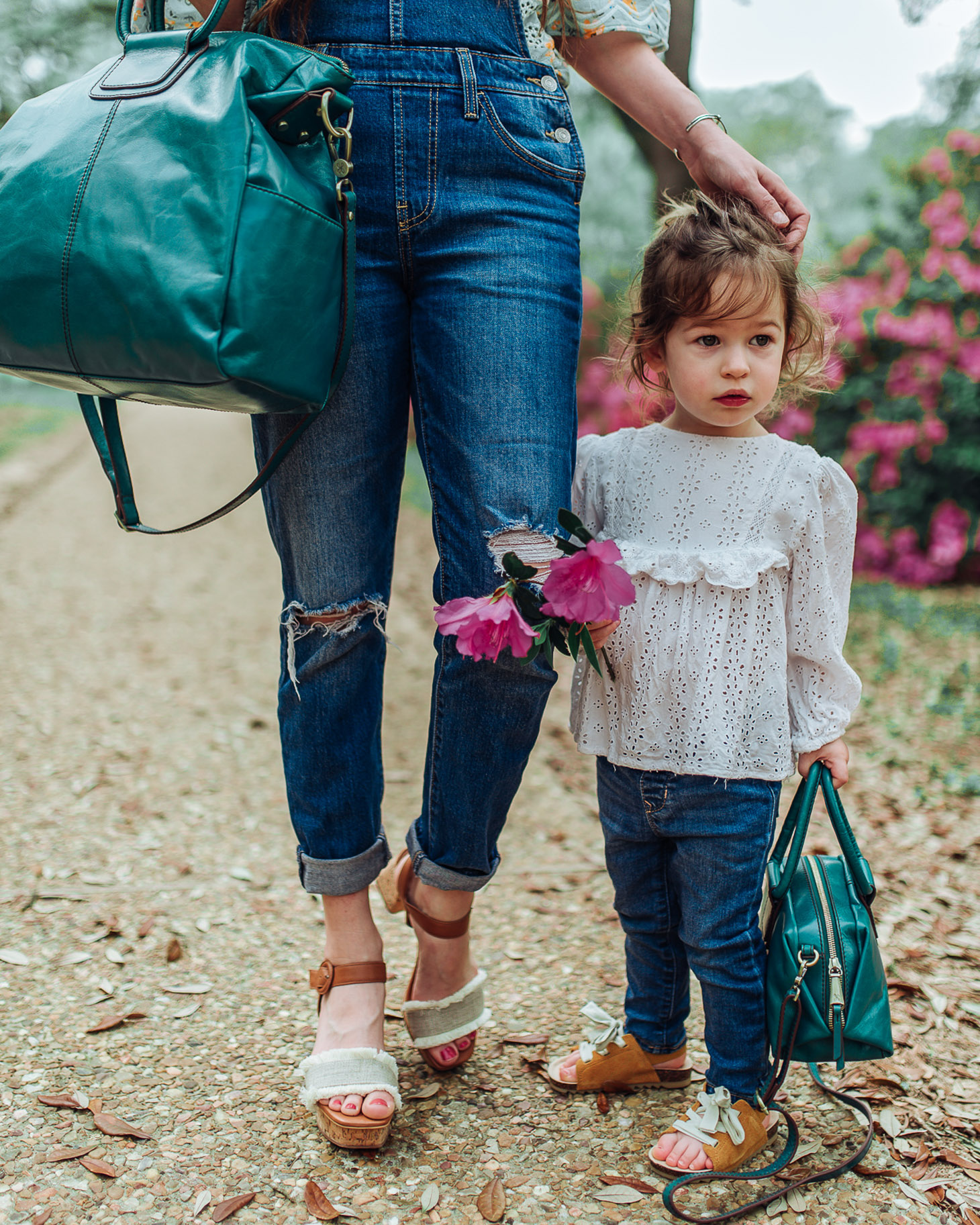 Last minute Mothers Day gifts featured by top US life and style blog, Lone Star Looking Glass: image of a mom and toddler duo wearing Shay and Sheila bags