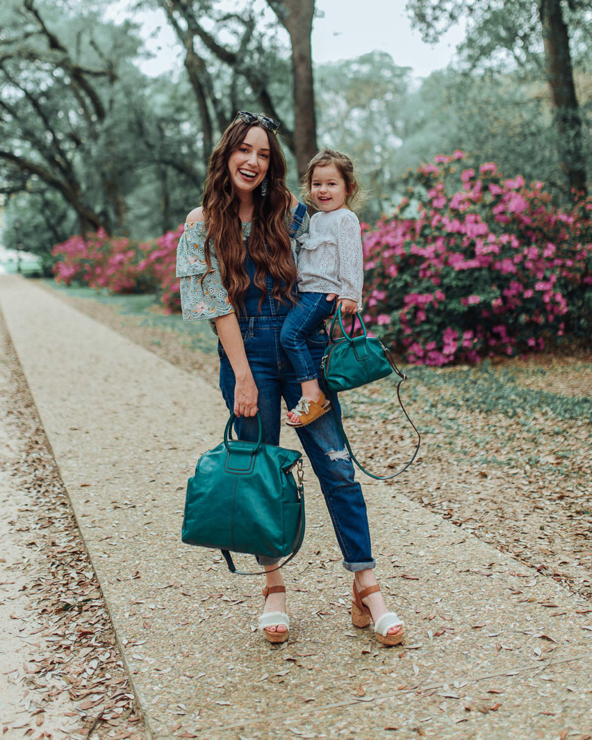 Last minute Mothers Day gifts featured by top US life and style blog, Lone Star Looking Glass: image of a mom and toddler duo wearing Shay and Sheila bags