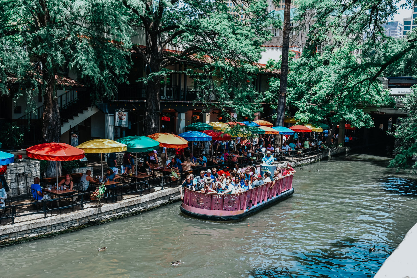 Top 10 Kid Friendly Activities in San Antonio by popular Texas travel blog, Lone Star Looking Glass: image of a river boat cruise at the San Antonio River Walk. 
