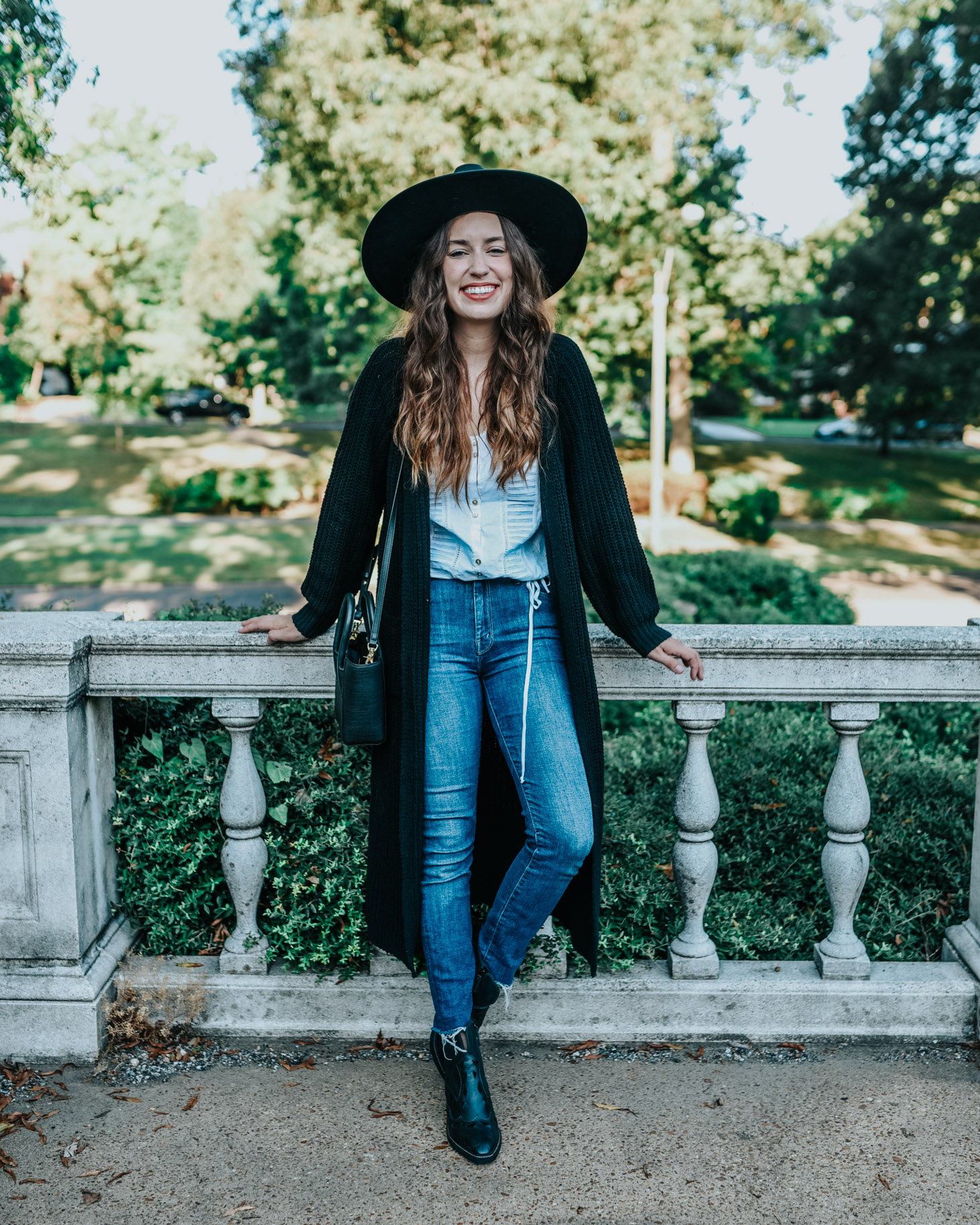 Cute fall cardigans featured by top US fashion blog, Lone Star Looking Glass: image of a woman wearing a Revolve long black fall cardigan, Anthropologie lace blouse, Kelsi Dagger Brooklyn booties, Mother fray jeans, and a Revolve Panama hat.