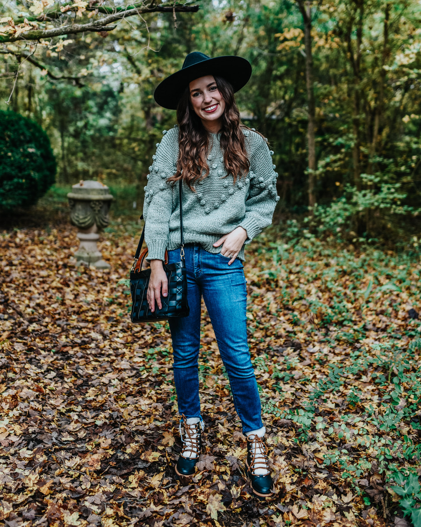 Fall Outfit Idea - Green Sweater & Combat Booties-5 | Fall Trends: Pom Pom Sweaters + Combat Boots by popular fashion blog, Lone Star Looking Glass: image of a woman outside wearing a Chicwish Pom-Pom Trim Chunky Knit Sweater in Green and MARC FISHER LTD Izzie Lugsole Ankle Boots. 