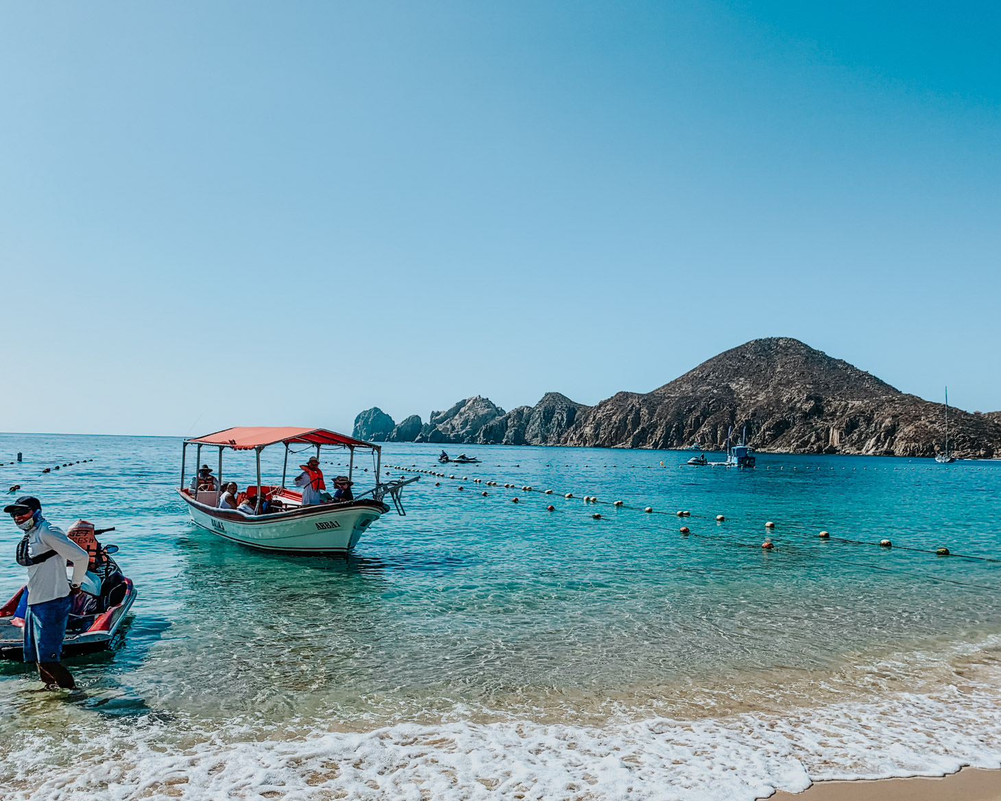 Pueblo Bonito Pacifica: 8 Reasons to Vacation in Cabo by popular Tennessee travel blog, Lone Star Looking Glass: image of boats docked in the Pacific ocean. 