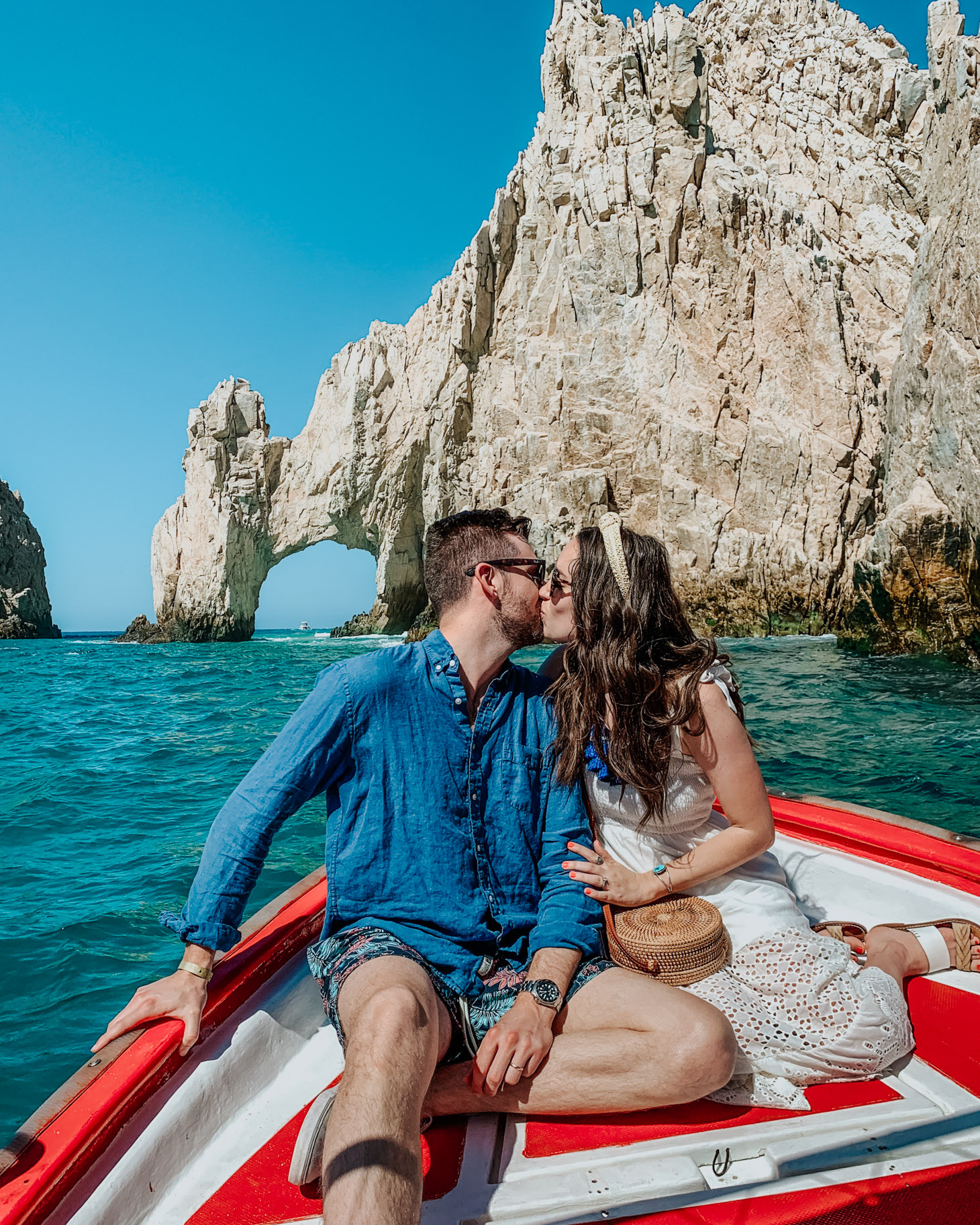 Pueblo Bonito Pacifica: 8 Reasons to Vacation in Cabo by popular Tennessee travel blog, Lone Star Looking Glass: image of a couple kissing in front of the Cabo Arch. 