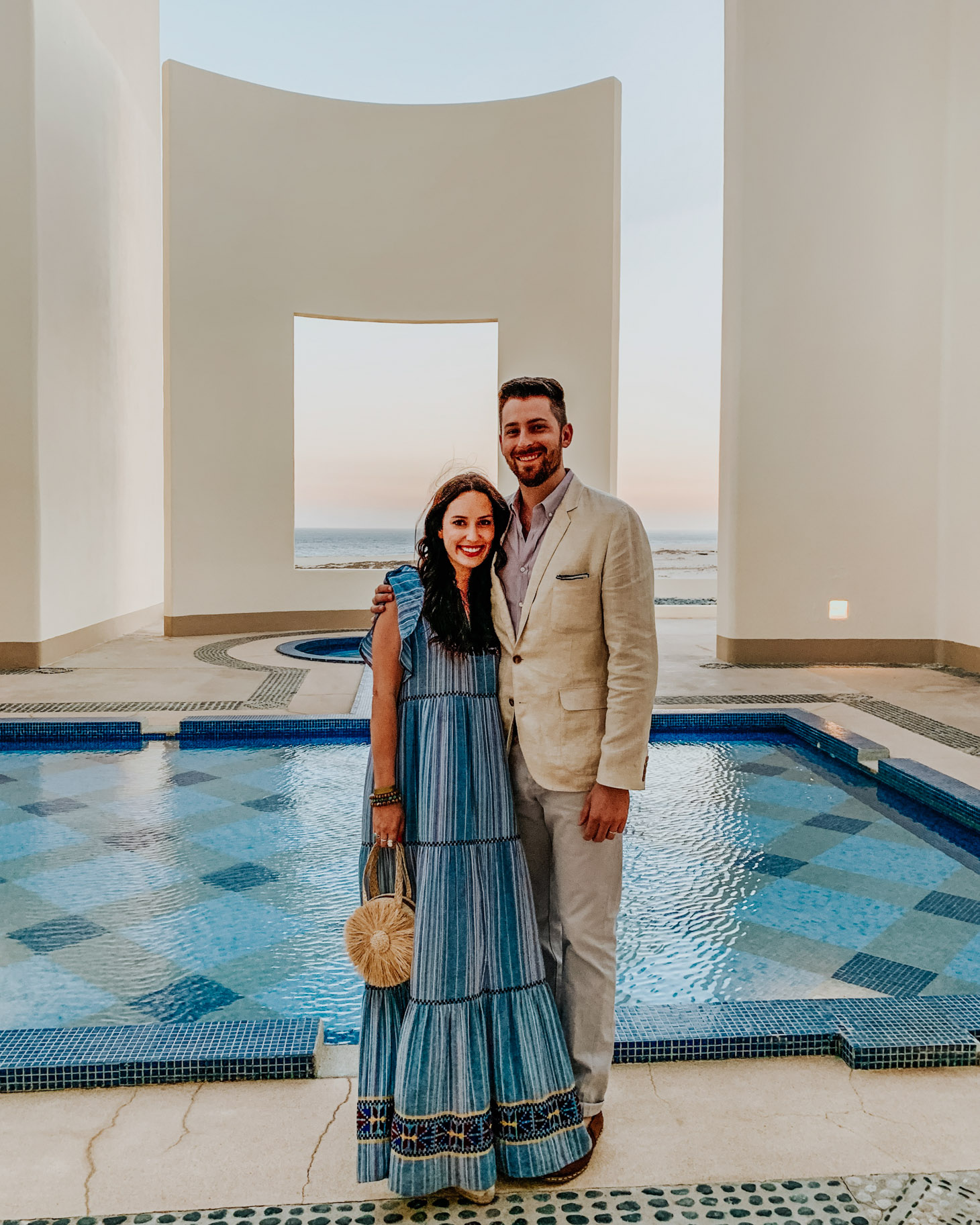 Pueblo Bonito Pacifica: 8 Reasons to Vacation in Cabo by popular Tennessee travel blog, Lone Star Looking Glass: image of a couple standing by and outdoor pool. 