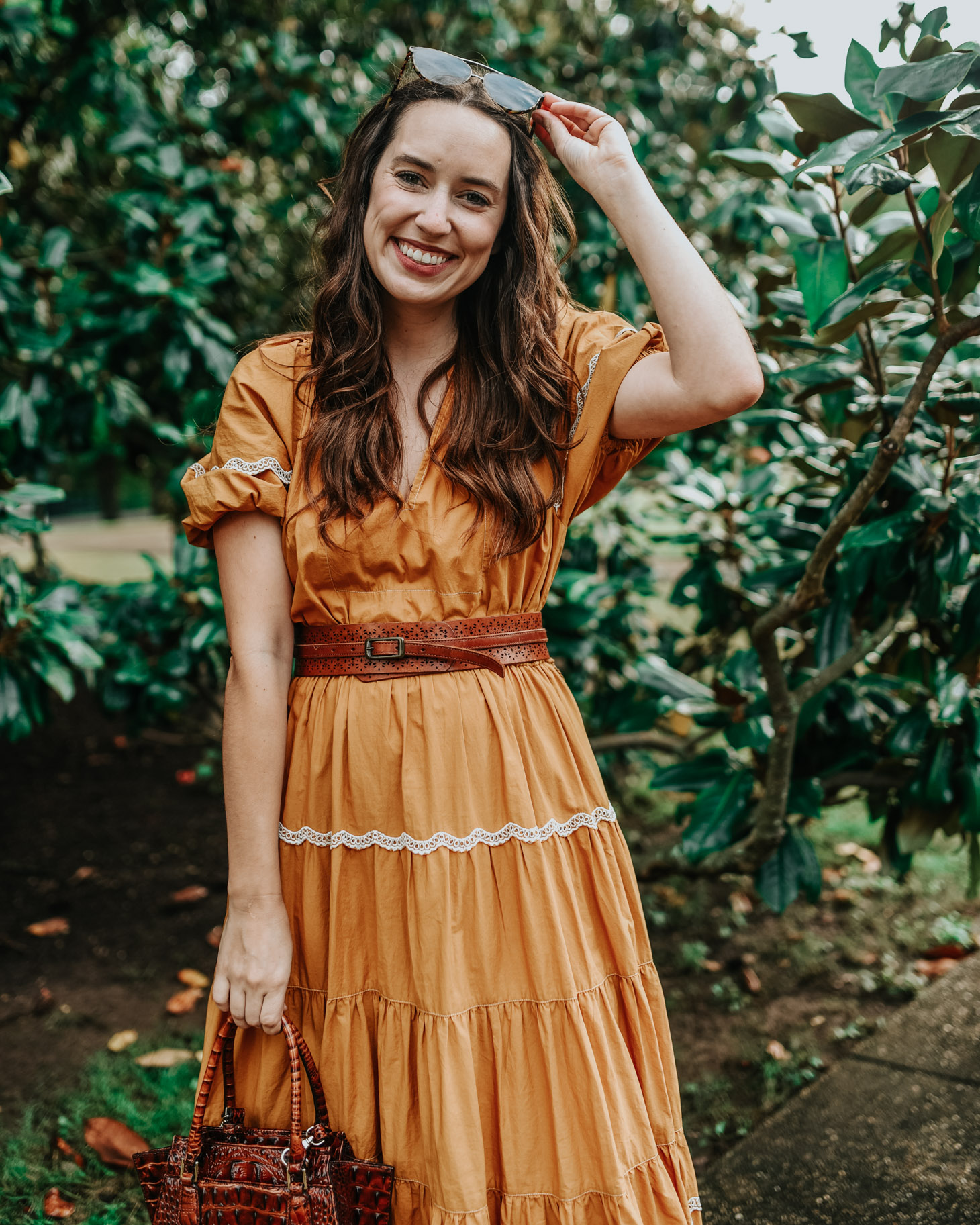 A Bold Yellow Maxi Dress for Fall by Popular Tennessee fashion blog, Lone Star Looking Glass: image of a woman standing outside and wearing a Ulla Johnson Claribel Dress..