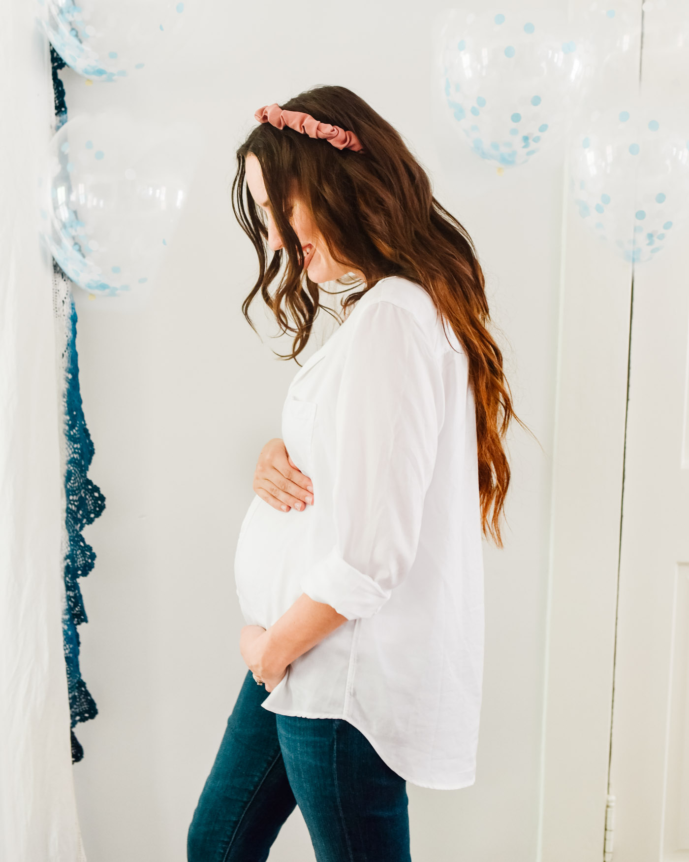 Boy Gender Reveal by popular Memphis lifestyle blog, Lone Star Looking Glass: image of a woman wearing a Anthropologie Grayson The Hero Buttondown, Shopbop Citizens of Humanity Maternity Racer Below the Belly Jeans, and Anthropologie Asher Plaid Headband.