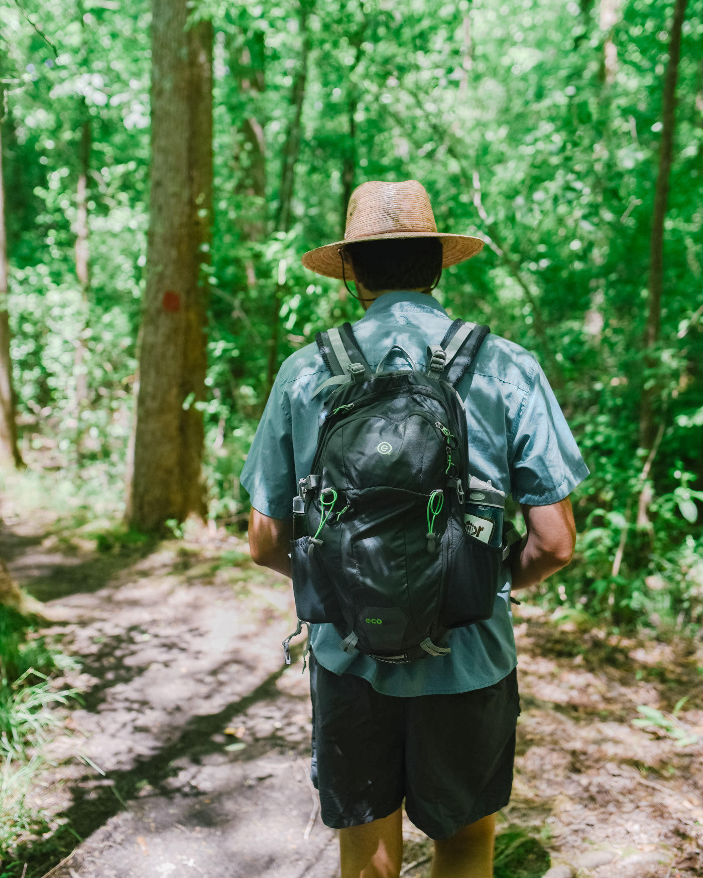 Father's Day Gift Ideas by popular Memphis lifestyle blog, Lone Star Looking Glass: image of a man wearing a Academy Sports Ecogear Hawskbill 30L Hiking Backpack. 