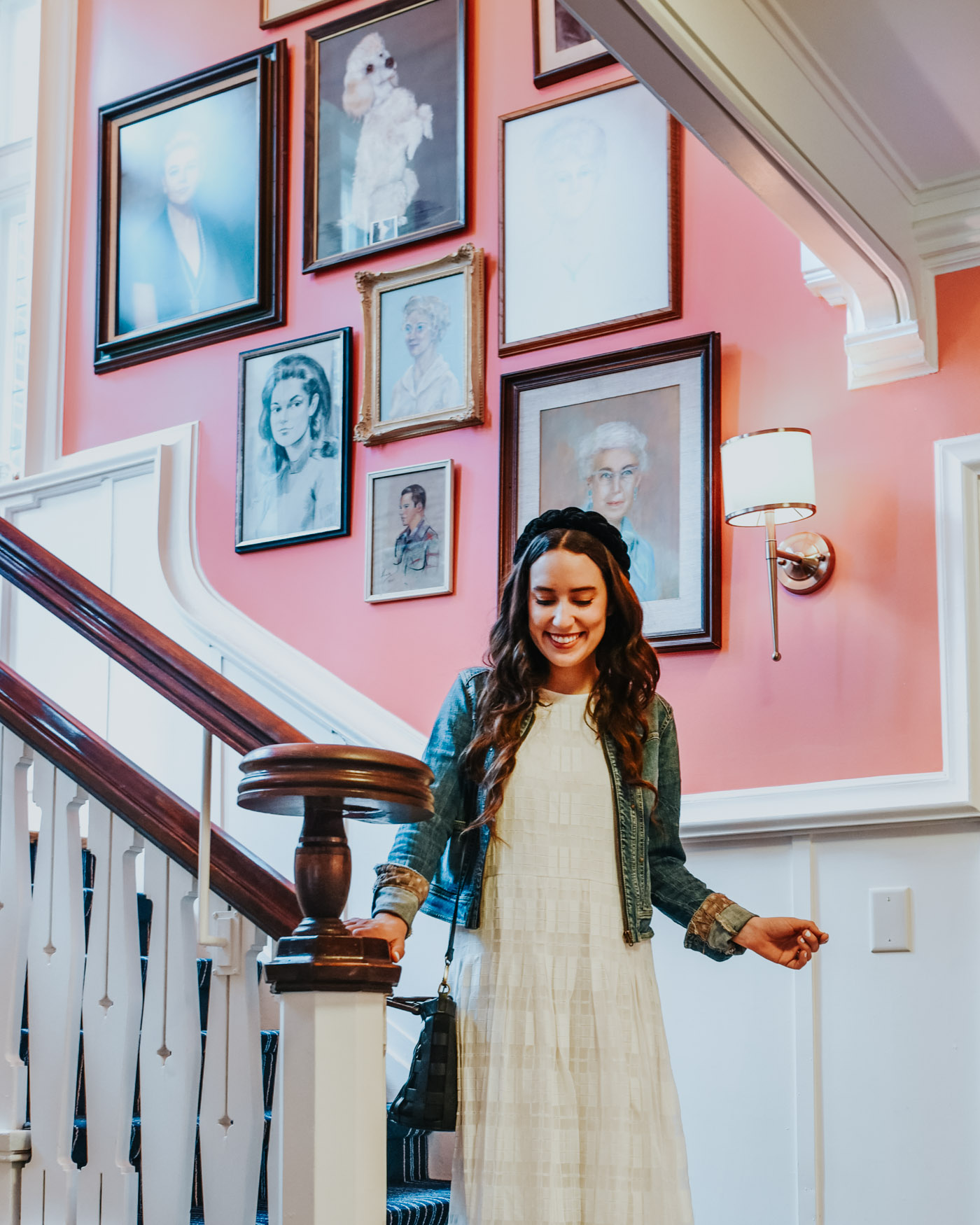 Things to do in Columbia SC by popular Memphis travel blog, Lone Star Looking Glass: image of a woman standing on a staircase at the Graduate hotel in Columbia SC.