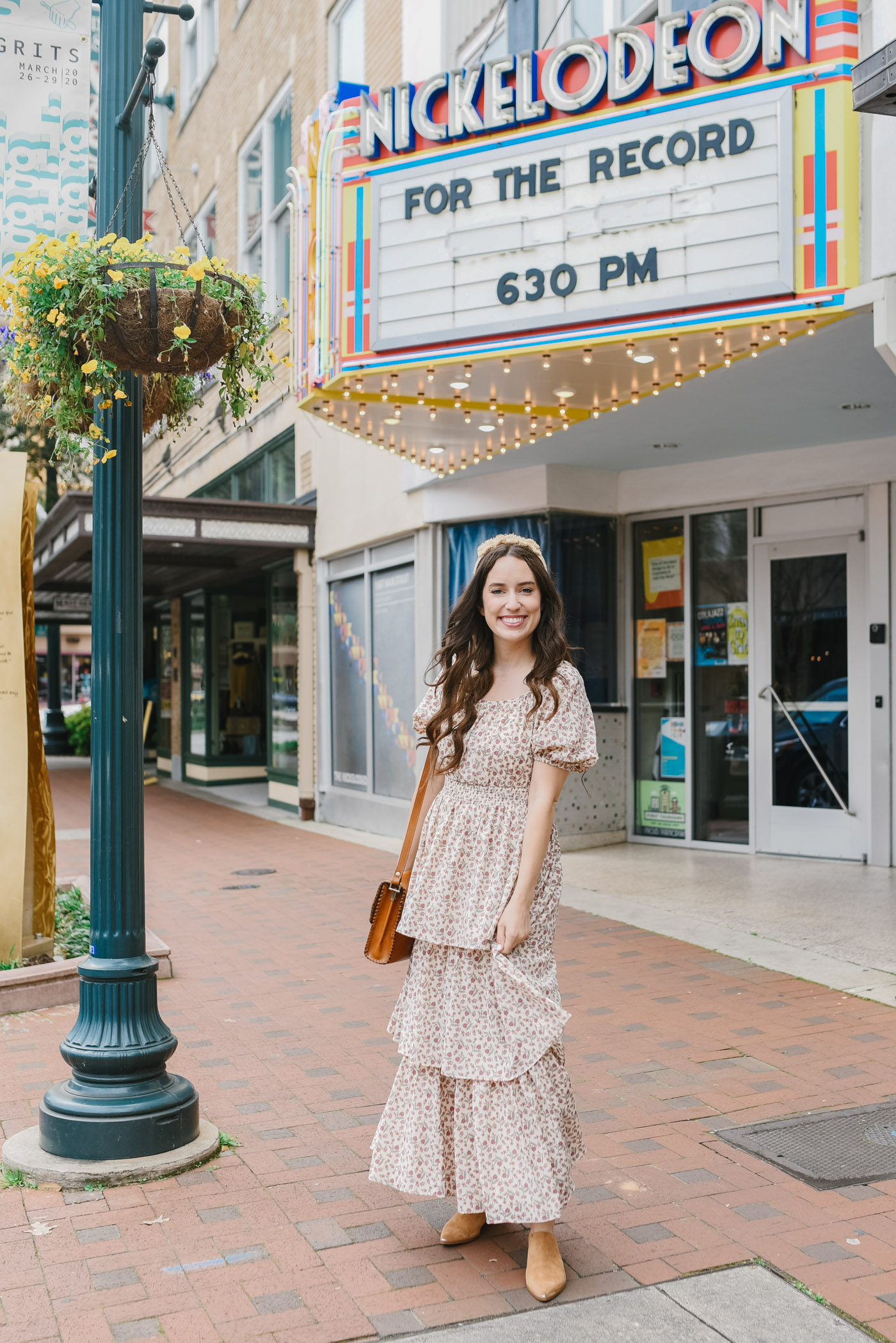 Things to do in Columbia SC by popular Memphis travel blog, Lone Star Looking Glass: image of a woman standing outside the Nickelodeon theater. 