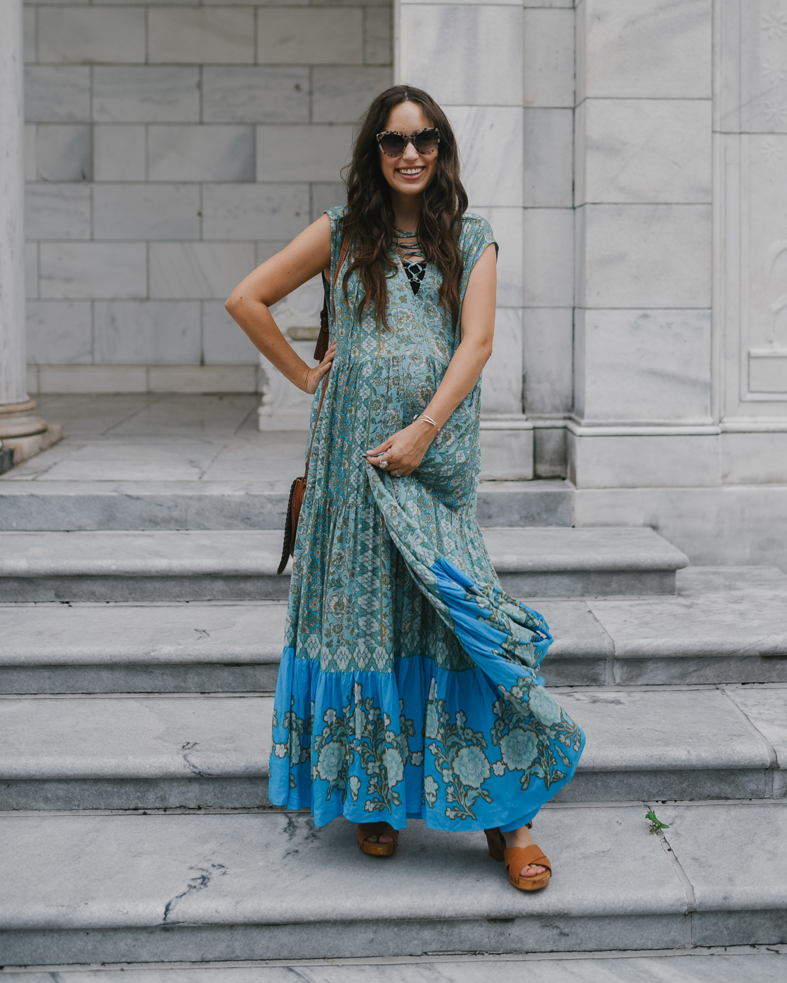Bohemian Maxi Dresses by popular Memphis fashion blog, Lone Star Looking Glass: image of a woman standing on some grey marble steps outside and wearing a Free People Western Cuff Set, Free People Hanalei Bay Dress, and Zappos Swedish Hasbeens Kringlan. 