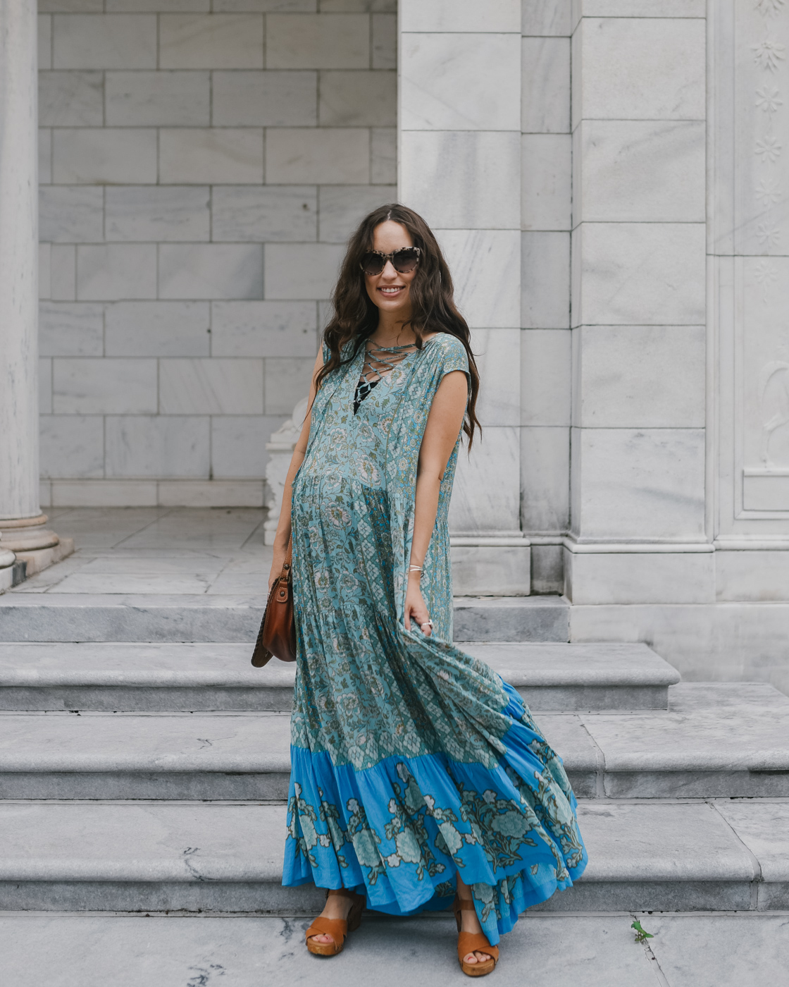 Bohemian Maxi Dresses by popular Memphis fashion blog, Lone Star Looking Glass: image of a woman standing on some grey marble steps outside and wearing a Free People Western Cuff Set, Free People Hanalei Bay Dress, and Zappos Swedish Hasbeens Kringlan. 