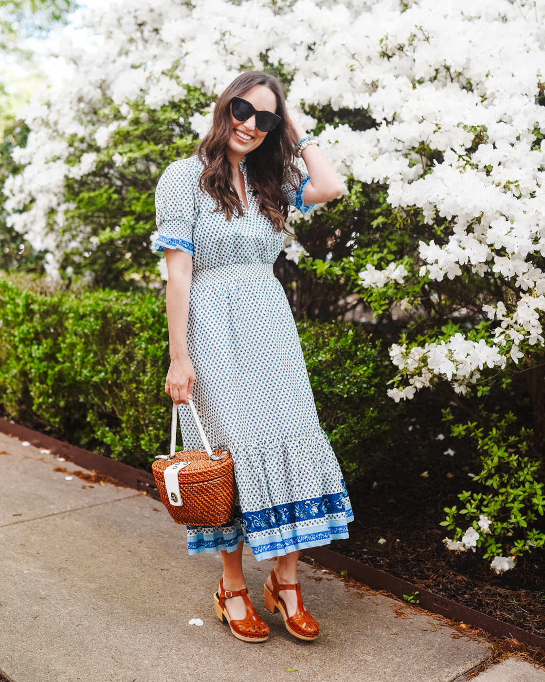 j crew smocked dress with swedish hasbeen clogs and a basket purse