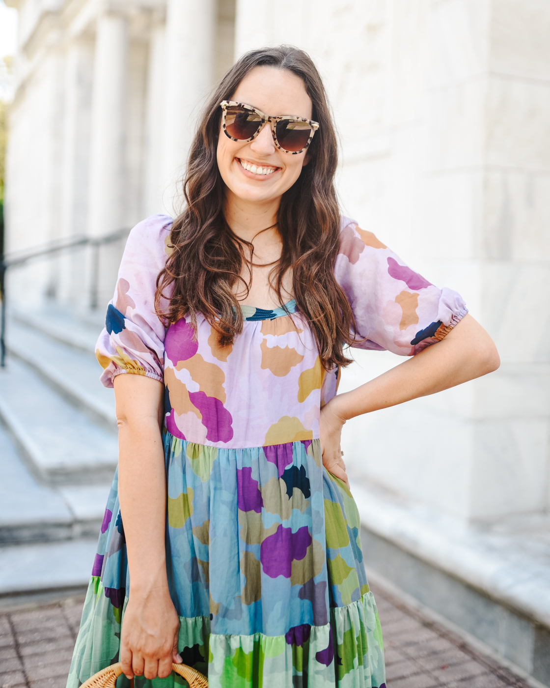Tiered Maxi Dress by popular Memphis fashion blog, Lone Star Looking Glass: image of a woman wearing floral tiered maxi dress, tan block heel sandals, tortoise shell frame sunglasses, and holding a wicker handbag. 