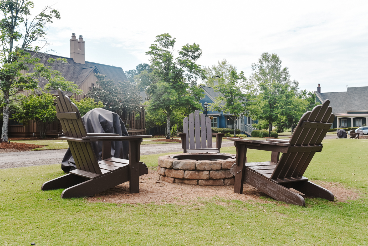 Barnsley Resort by popular Memphis travel blog, Lone Star Looking Glass: image of some wooden chairs around a fire pit. 