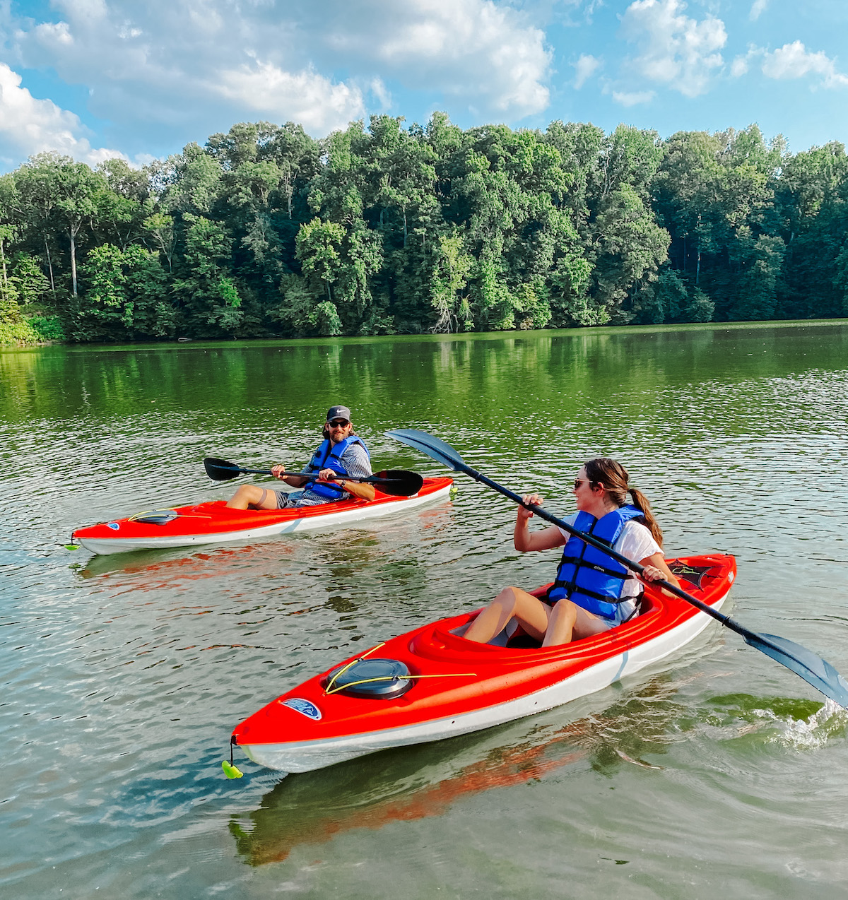 Kayaking for Beginners by poplar Memphis lifestyle blog, Lone Star Looking Glass: image of a husband and wife kayaking on a lake. 