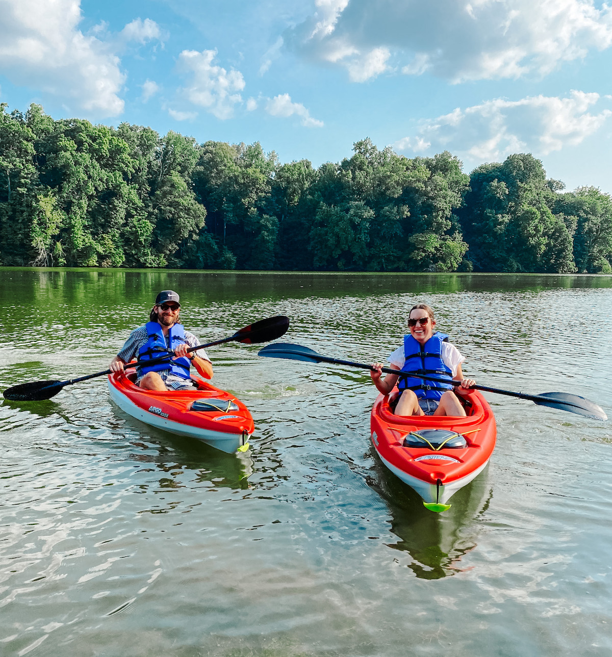 Kayaking for Beginners by poplar Memphis lifestyle blog, Lone Star Looking Glass: image of a husband and wife kayaking on a lake. 