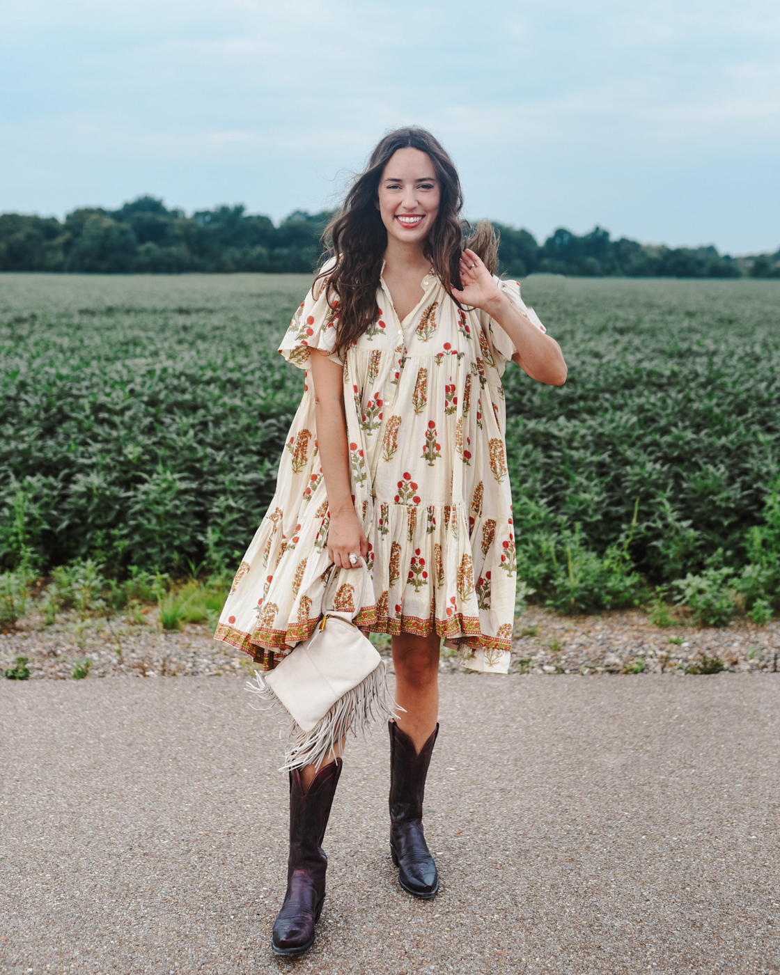 lekha block print lopa III dress, black cherry lucchese boots, alice kerley tennessee blogger | Babydoll Dress by popular Memphis fashion blog, Lone Star Looking Glass: image of a woman standing in a road and wearing a Lekah block print lopa III dress and black cherry lucchese boots.