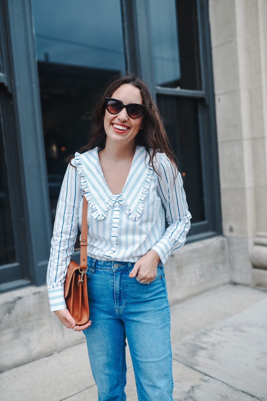 Ruffled Collar Shirts styled by top Memphis fashion blogger, Lone Star Looking Glass: image of a woman wearing an Anthropologie ruffled shirt